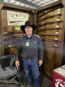 Gun Show - Employee at Gun Show Booth